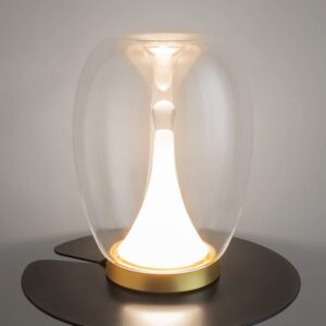 Включена LED настолна лампа Maytoni Splash MOD282TL-L15G3K1 върху черна помощна маса