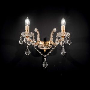 Златистият аплик Ideal Lux Florian AP2 035659 с две светещи крушки и висящи кристали на тъмен фон