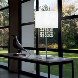 Настолна лампа Ideal Lux Opera TL1 068305 върху маса до прозорец